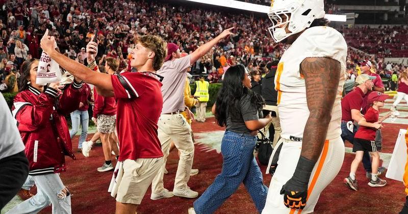 Tennessee defensive lineman Ethan Utley (17) walks off the field as South Carolina fans storm the field during a college football game between Tennessee and South Carolina at Williams-Brice Stadium in Columbia, S.C., on Oct. 24, 2026.