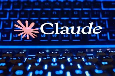 Illustration showing the Claude logo and a keyboard