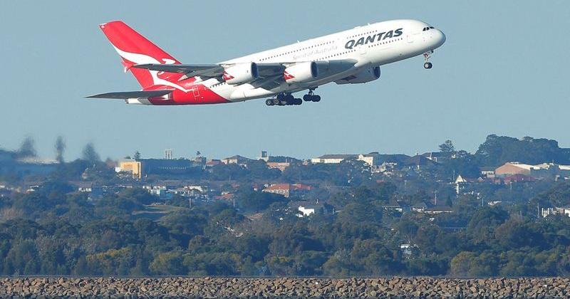 FILE PHOTO: Qantas flight QF1, an Airbus A380 aircraft, takes off from Sydney International Airport en route to Dubai, above Botany Bay