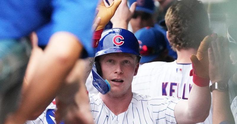 Chicago Cubs center fielder Pete Crow-Armstrong is greeted in the dugout after hitting a two-run home run against the Los Angeles Dodgers during the fourth inning at Wrigley Field.