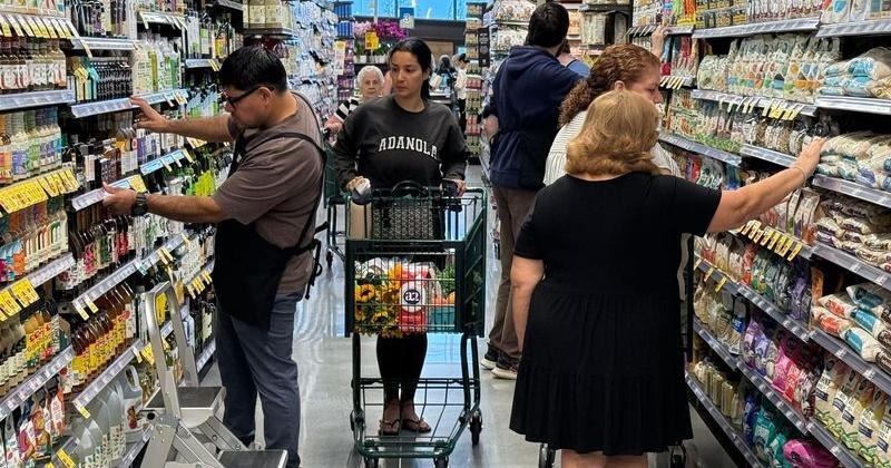 Shoppers browse an aisle at Whole Foods Market in Eatontown on July 29, 2026, it...