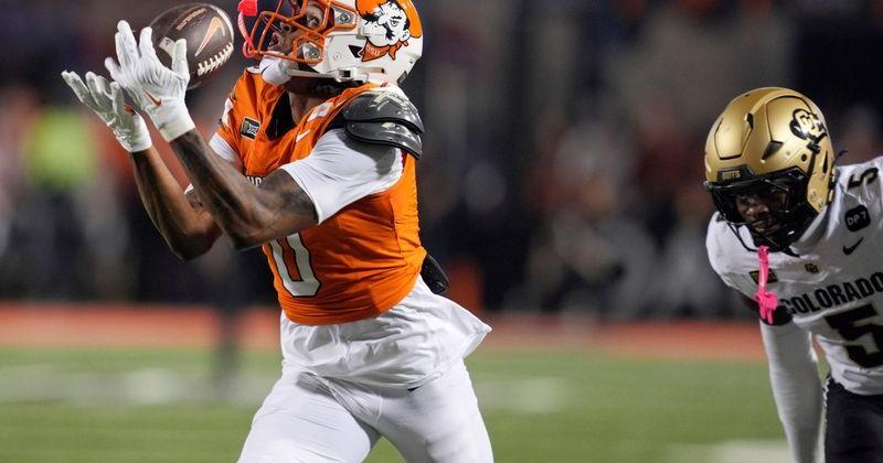 Oklahoma State Cowboys wide receiver Justin Bowick (0) catches the ball ion front of Colorado Buffaloes defensive back RJ