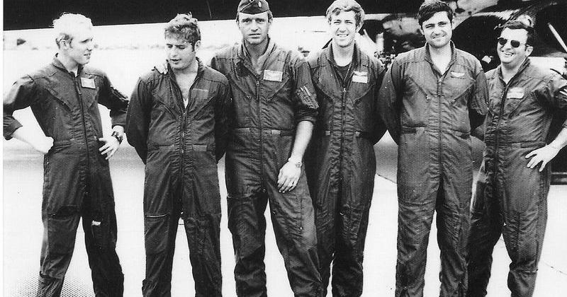 Jeremy Redmon's father, Donald Redmon, third from right, with his B-52 crewmates during the Vietnam War in 1972. They experienced harrowing close calls during their missions over Southeast Asia. Partly to better understand his father, Jeremy Redmon reported on the war in Iraq for months while embedded with U.S. soldiers and Marines. Years later, he traveled to Hanoi to write about the history of the Vietnam War.