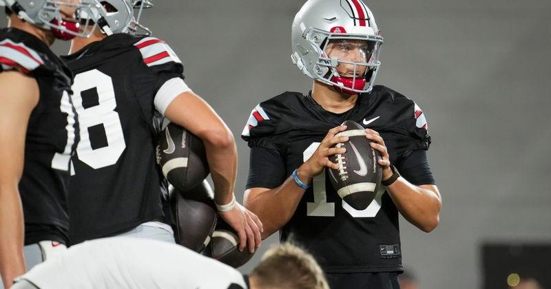 Ohio State Buckeyes quarterback Julian Sayin (10) holds a football during training camp inside the Woody Hayes Athletic Center in Columbus on Aug. 7, 2026.