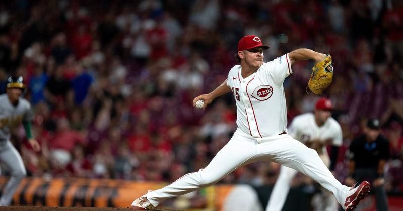 Cincinnati Reds pitcher Emilio Pagan (15) delivers a pitch in the ninth inning between the Athletics and Cincinnati Reds at