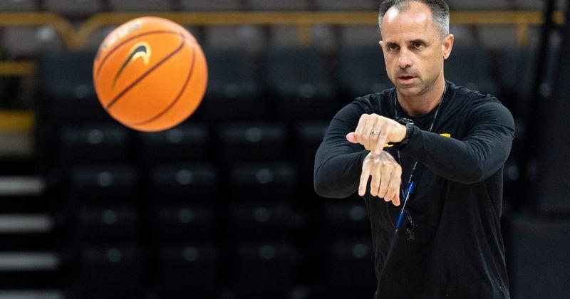 Iowa head coach Ben McCollum passes the ball Oct. 12, 2026 during an Iowa men’s basketball open practice at Carver-Hawkeye Arena