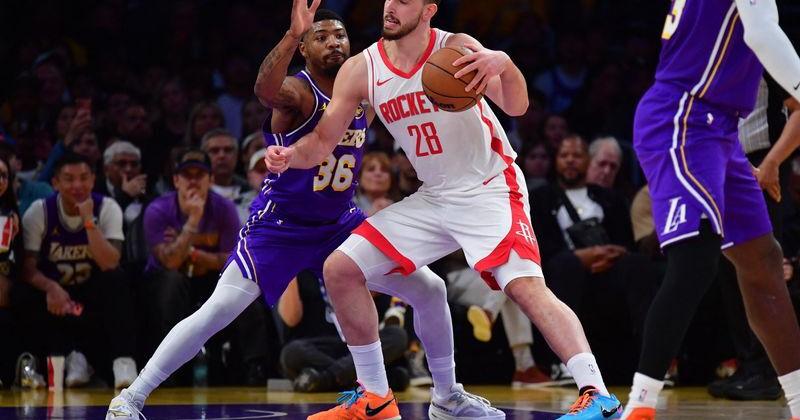 Apr 29, 2026; Los Angeles, California, USA; Houston Rockets center Alperen Sengun (28) moves the ball against Los Angeles Lakers guard Marcus Smart (36) during the first half in game five of the first round of the 2026 NBA Playoffs at Crypto Arena. Mandatory Credit: Gary A. Vasquez-Imagn Images
