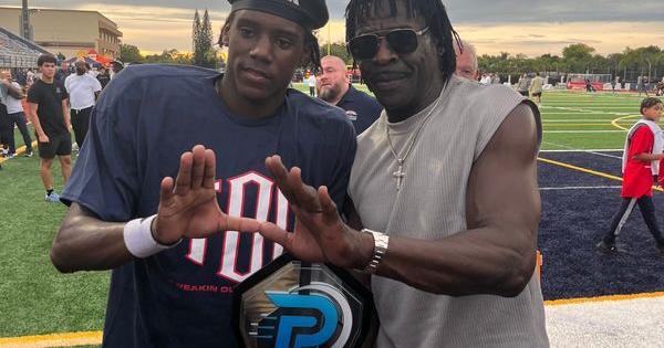 Columbus athlete and Miami commit A'mir Sears with former University of Miami star and Pro Football Hall of Famer Michael Irvin at St. Thomas Aquinas on Aug. 29, 2026.