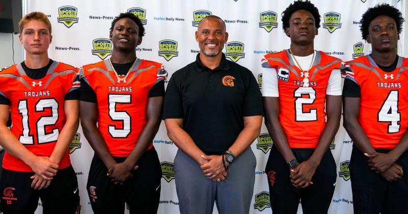 From left: Lely football’s Luke Trebilcock, Billy Bornelus, coach Dan Nieboer, Maks Noel and Warren Williamseau pose for a photo at the Naples Daily News in Naples, Fla., on Friday, July 31, 2026.