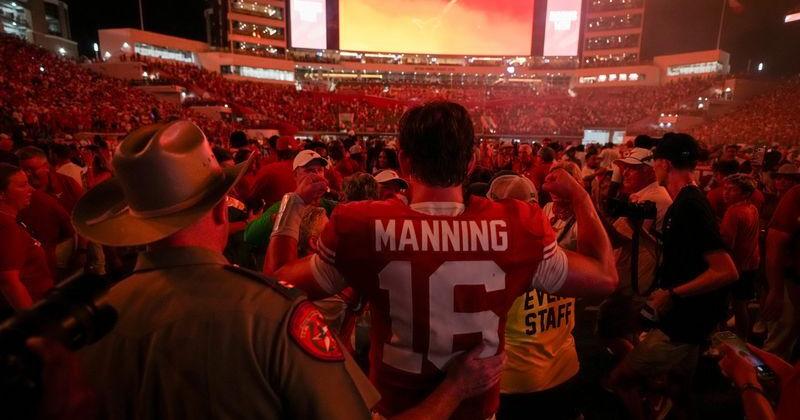 Fans celebrate with Texas quarterback Arch Manning (16) after the team's defeat of Ohio State at Darrell K Royal–Texas Memorial Stadium in Austin, Texas on Sept. 12, 2026.