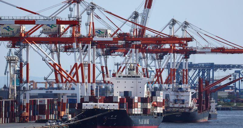 Cargo ship carrying containers at an industrial port within Tokyo Port