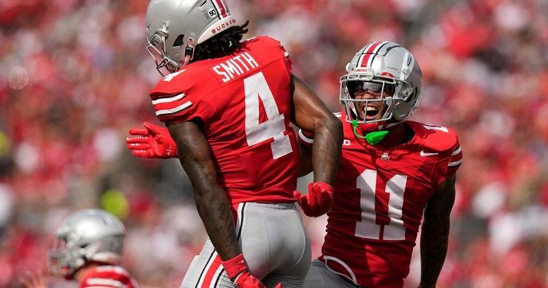 Ohio State Buckeyes wide receiver Brandon Inniss (11) celebrates a touchdown catch by wide receiver Jeremiah Smith (4) during the first half of the NCAA football game against the Akron Zips at Ohio Stadium.
