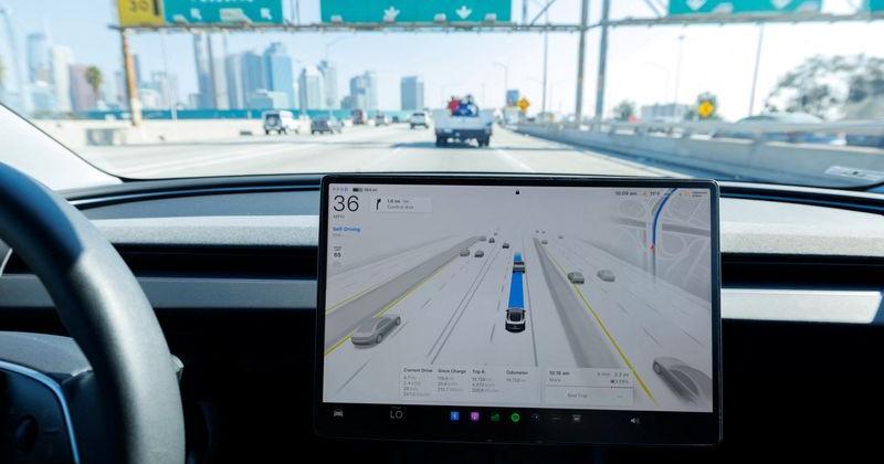 A 2025 Tesla Model 3 self-drives with FSD 14.1.4 software on a Los Angeles freeway