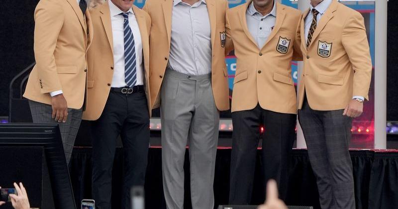 The 2026 class of enshrines from left, Larry Fitzgerald, Adam Vinatieri, Luke Kuechly , Roger Craig, and Drew Brees pose for