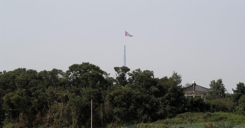 North Korean flag flatters on the top of 160-metre tower at North Korea’s propaganda village of Gijungdong in this picture taken from Tae Sung freedom village near the Military Demarcation Line (MDL), inside the demilitarised zone separating the two Kore
