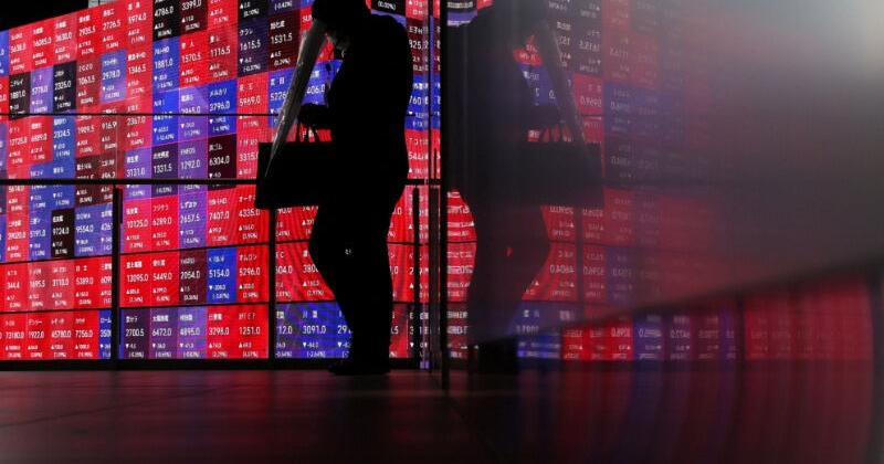 Shares skid in Asia as oil climbs, rate hikes loom