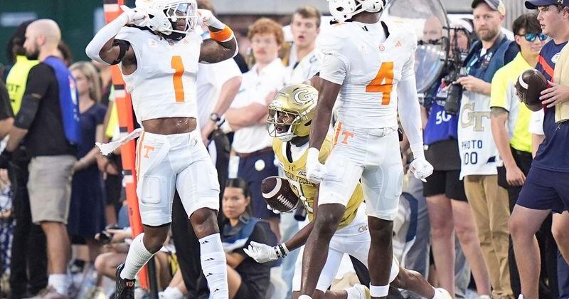 Tennessee defensive back TJ Metcalf (1) and Tennessee defensive back Ty Redmond (4) celebrate on the field during a college