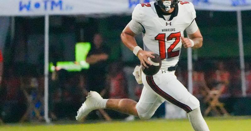 Thompson's Trent Seaborn rolls out to pass against Central-Phenix City during the AHSAA Football Kickoff Classic Game in Phenix City, Ala., on Thursday August 20, 2026.