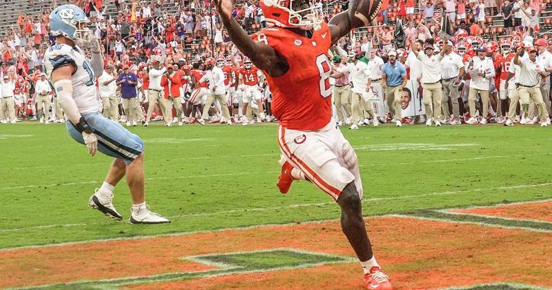 Clemson running back Gideon Davidson (8) scores a touchdown against the North Carolina Tar Heels during an NCAA football game at Memorial Stadium in Clemson, South Carolina.