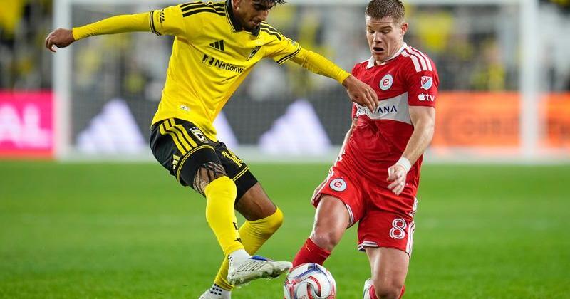 Columbus Crew midfielder Taha Habroune (16) kicks the ball past Chicago Fire forward Chris Mueller (8) during the first half of