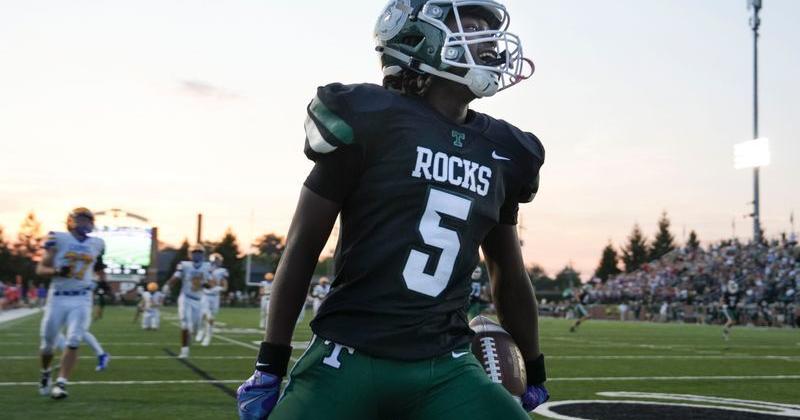 Trinity's Jayce Duvall celebrates his touchdown run in the first half against Carmel in high school football at Marshall Stadium in Louisville, Kentucky Friday, Sept. 12, 2025.