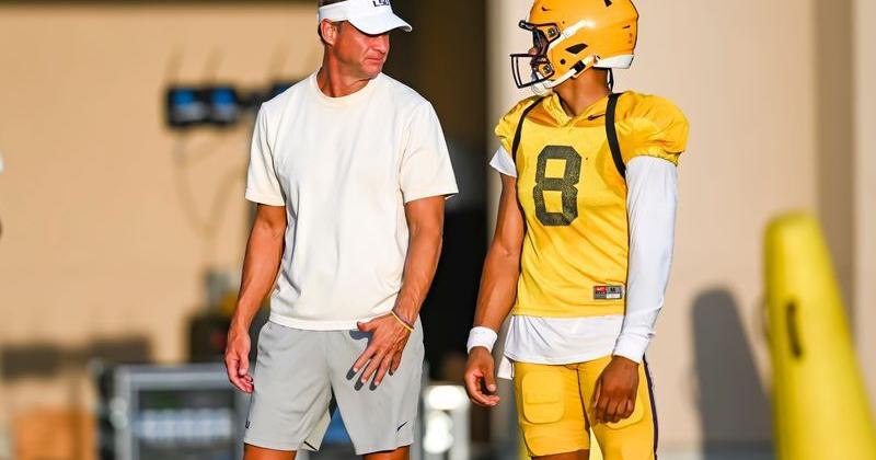 LSU Tigers head football coach Lane Kiffin talking with Quarterback Husan Longstreet 8 at LSU Football practice. August 18,