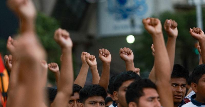 Demonstrators march to demand justice for the disappearance of students of Ayotzinapa Rural Teachers' College, in Mexico City