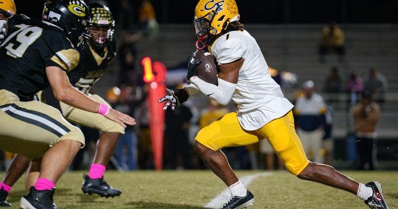 Landon Cline (79) gets set to defend as Tai Phillips carries the ball during the Cape Fear at Gray's Creek football game on Friday, Oct. 17, 2025.