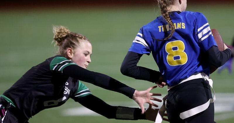 Savanna Hartman (6) grabs the flag of Teagan Schell (8) during the opening round of the District 3 1A/2A Girls Flag Football Tournament at Olympic High School on Friday, Jan. 30, 2026.
