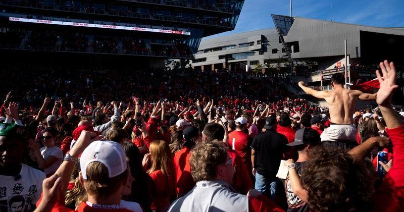 Cincinnati Bearcats fans charge the field after the Cincinnati Bearcats defeated Texas Tech Red Raiders at Nippert Stadium in
