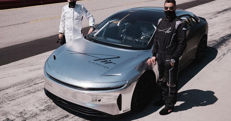 Lucid CEO Peter Rawlinson, left, and chief engineer Eric Bach with Lucid Air at test track