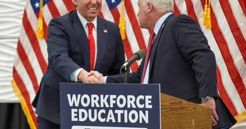 Florida Gov. Ron DeSantis greets Indian River State College president Tim Moore (right) during a Feb. 7, 2024, visit to the school's Fort Pierce campus.  DeSantis presented IRSC with a $4 million grant at the event.