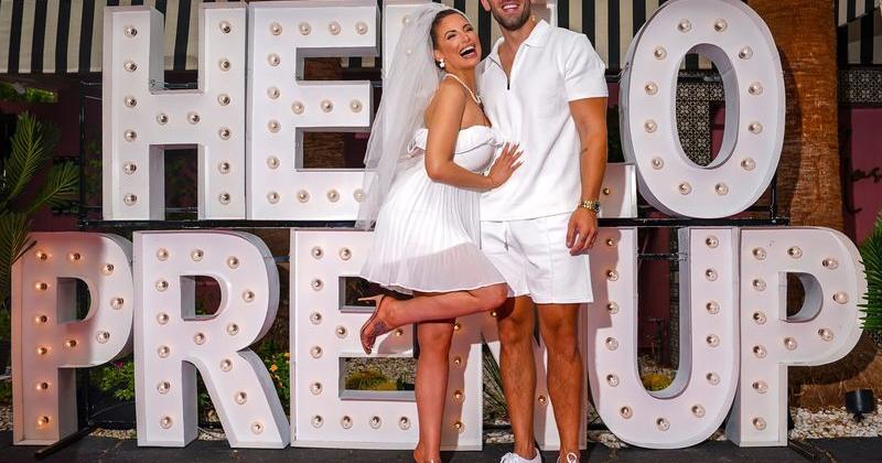 Model and influencer Ashley Alexiss and her fiance Brodie John pose for a photo together on the pink carpet during their prenup party at The Muse Hotel in Palm Springs, Calif., Thursday, Aug. 28, 2025.