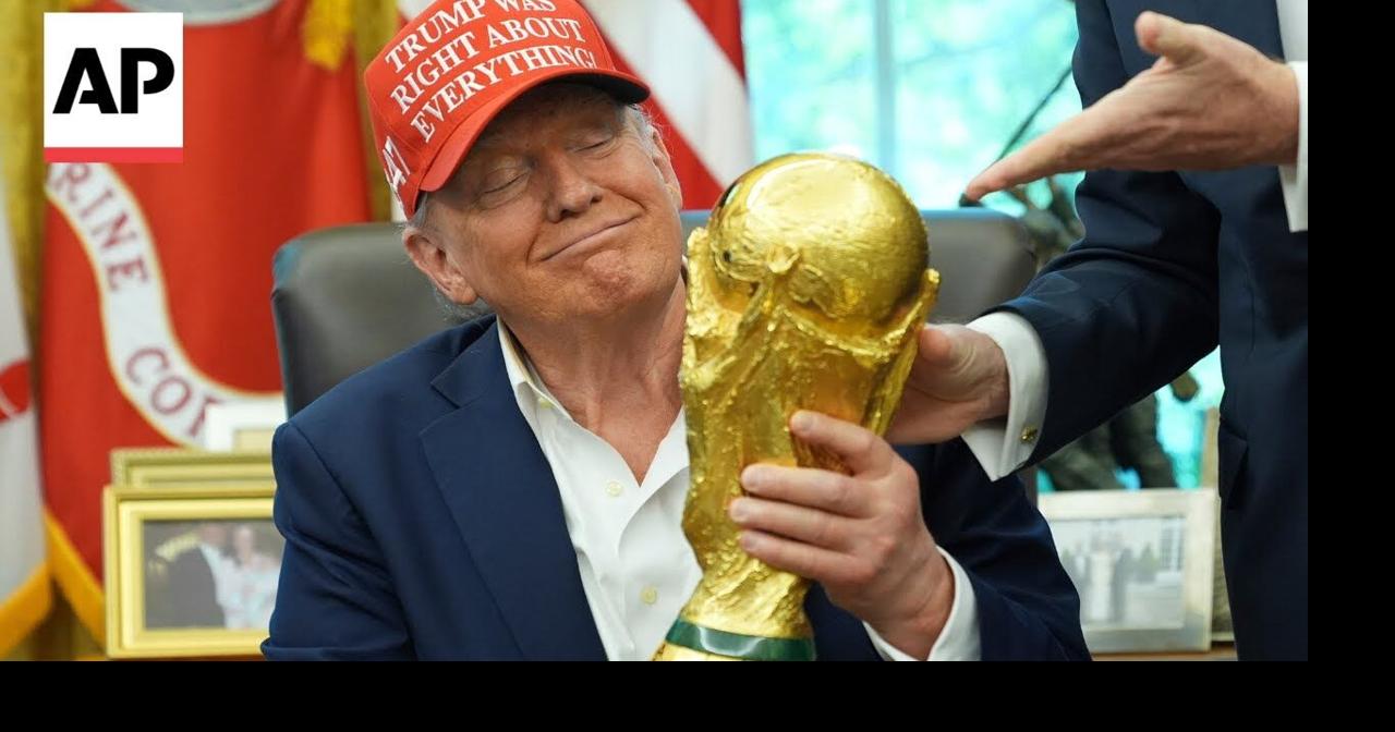 trump-holds-the-world-cup-trophy-and-receives-ticket-to-the-final-ap