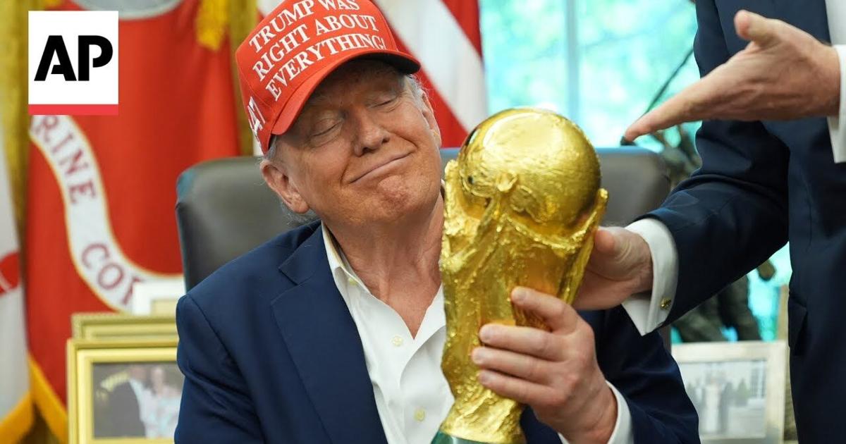 Trump Holds The World Cup Trophy And Receives Ticket To The Final Ap trump-holds-the-world-cup-trophy-and-receives-ticket-to-the-final-ap