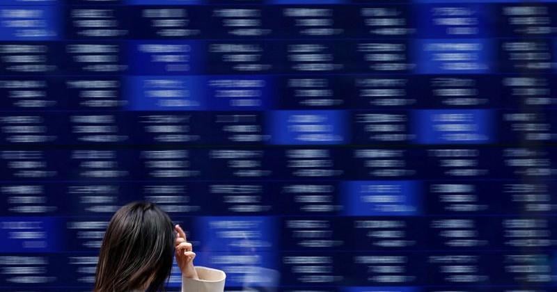 Global stocks hold steady ahead of Fed decision, earnings from AI stalwarts