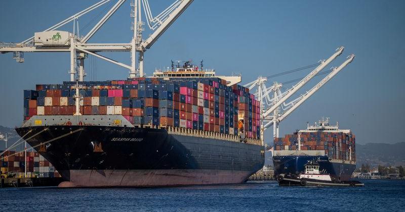 FILE PHOTO: A cargo ship full of shipping containers is seen at the port of Oakland, California