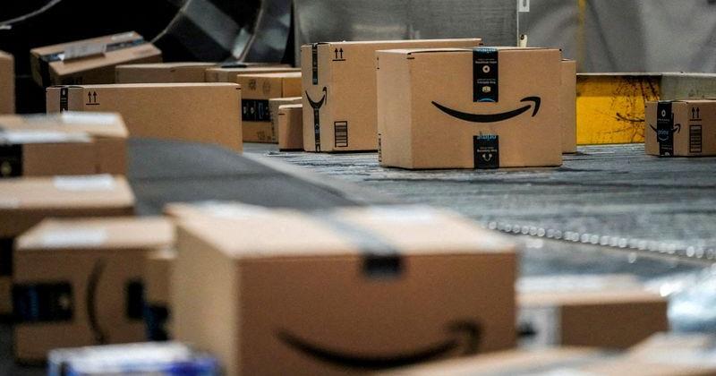 FILE PHOTO: An Amazon box moves along a conveyor belt at Amazon’s fulfillment center in New Jersey