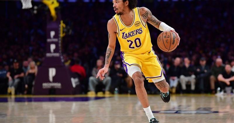 Feb 10, 2026; Los Angeles, California, USA; Los Angeles Lakers guard Nick Smith Jr. (20) moves the ball against the San Antonio Spurs during the first half at Crypto Arena. Mandatory Credit: Gary A. Vasquez-Imagn Images