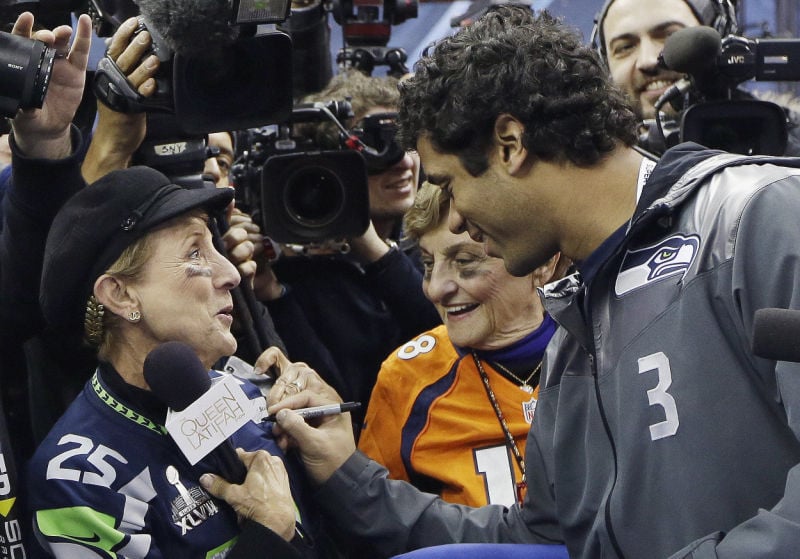 Nfl Super Bowl Media Day All About Hugs Hair For Ex Badger Russell Wilson Seahawks Pro Football Madison Com