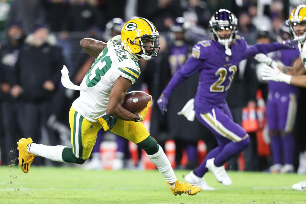 BALTIMORE, MD - DECEMBER 19: Packers wide receiver Davante Adams (17) runs  after a catch during the Green Bay Packers versus Baltimore Ravens NFL game  at M&T Bank Stadium on December 19