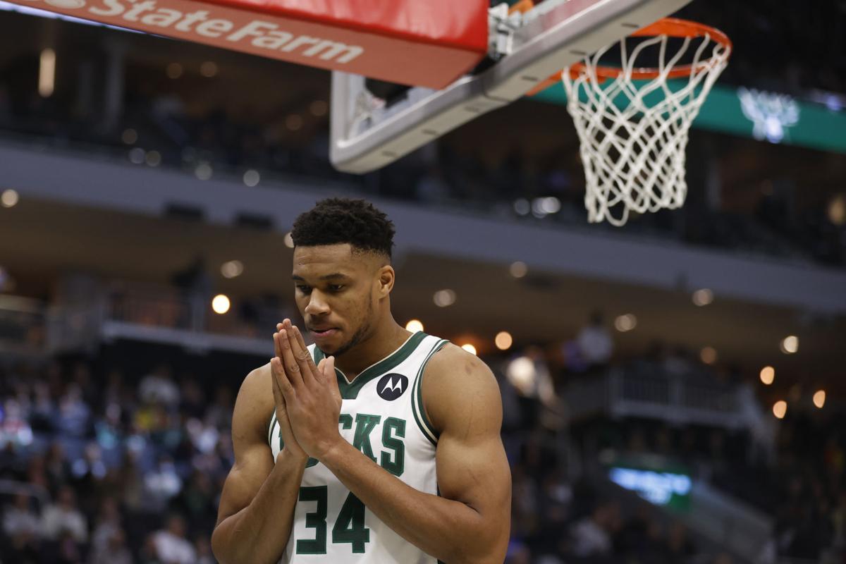 Giannis Antetokounmpo prays, AP photo