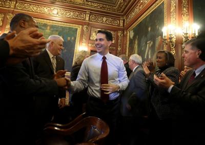 Scott Walker with cabinet extraordinary bills