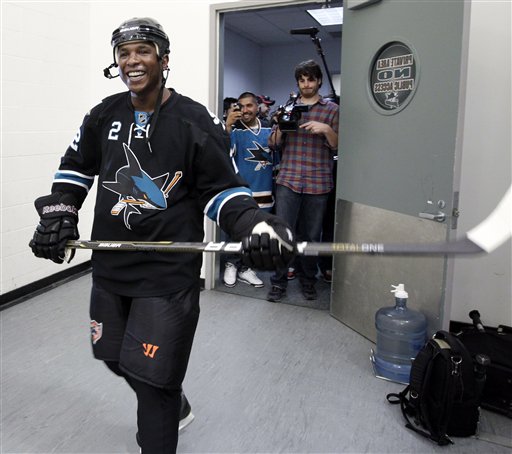 Milwaukee Brewers' Tony Plush (Nyger Morgan) puts on his skates with Sharks