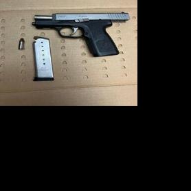 Man arrested with gun after dropping it at East Towne store