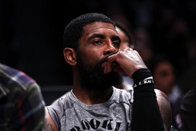 In this file photo, Kyrie Irving of the Brooklyn Nets looks on from the bench during a game against the Chicago Bulls at Barclays Center on Nov. 1, 2022, in New York.