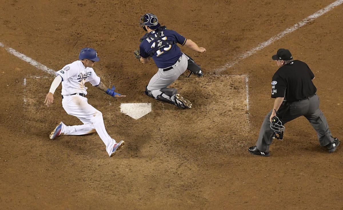 Manny Machado scores winning run NLCS Game 4, AP photo