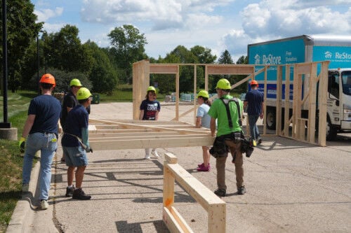A parking lot full of possibility: American Family Insurance builds with Habitat Dane
