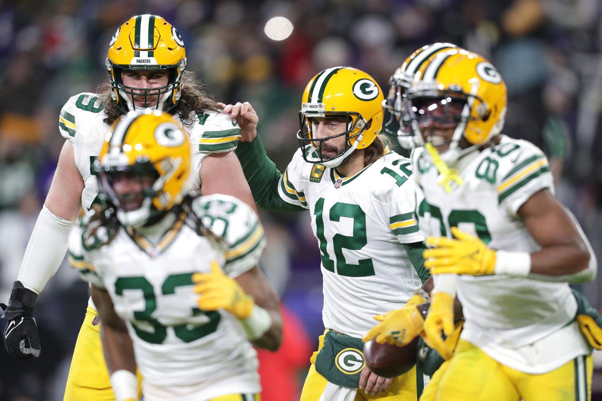 BALTIMORE, MD - DECEMBER 19: Packers running back A.J. Dillon (28) runs the  ball during the Green Bay Packers versus Baltimore Ravens NFL game at M&T  Bank Stadium on December 19, 2021