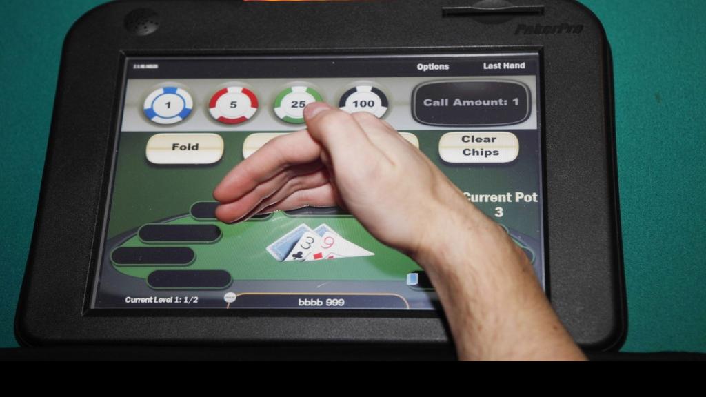 Electronic poker draws crowds, but are machines illegal? | Business